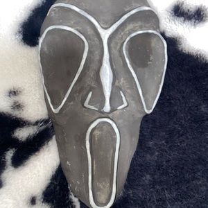 Antique face sculpture